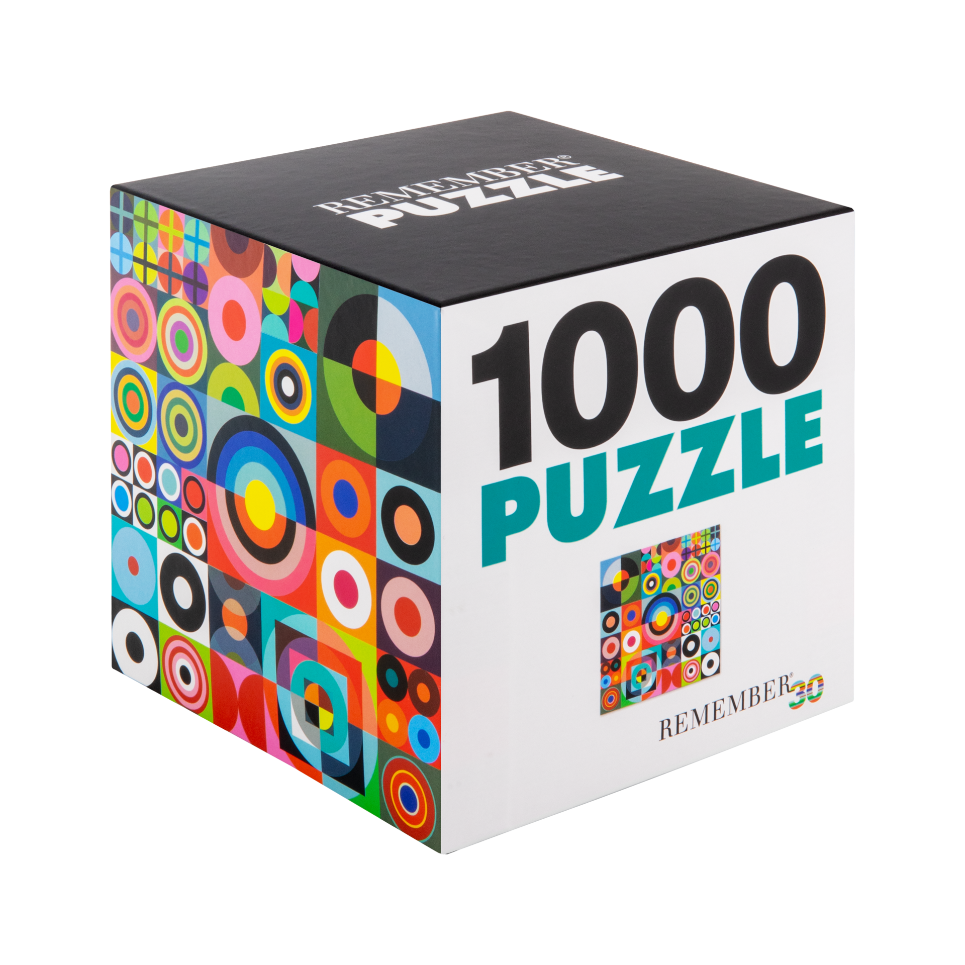 Bunter, kubischer Karton für ein 1000-Teile-Puzzle. Seiten mit lebhaftem geometrischem Muster aus Kreisen und Quadraten in Blau, Grün, Pink und Orange. Oben „REMEMBER PUZZLE“, vorn „1000 PUZZLE“ und klein „REMEMBER 30“.