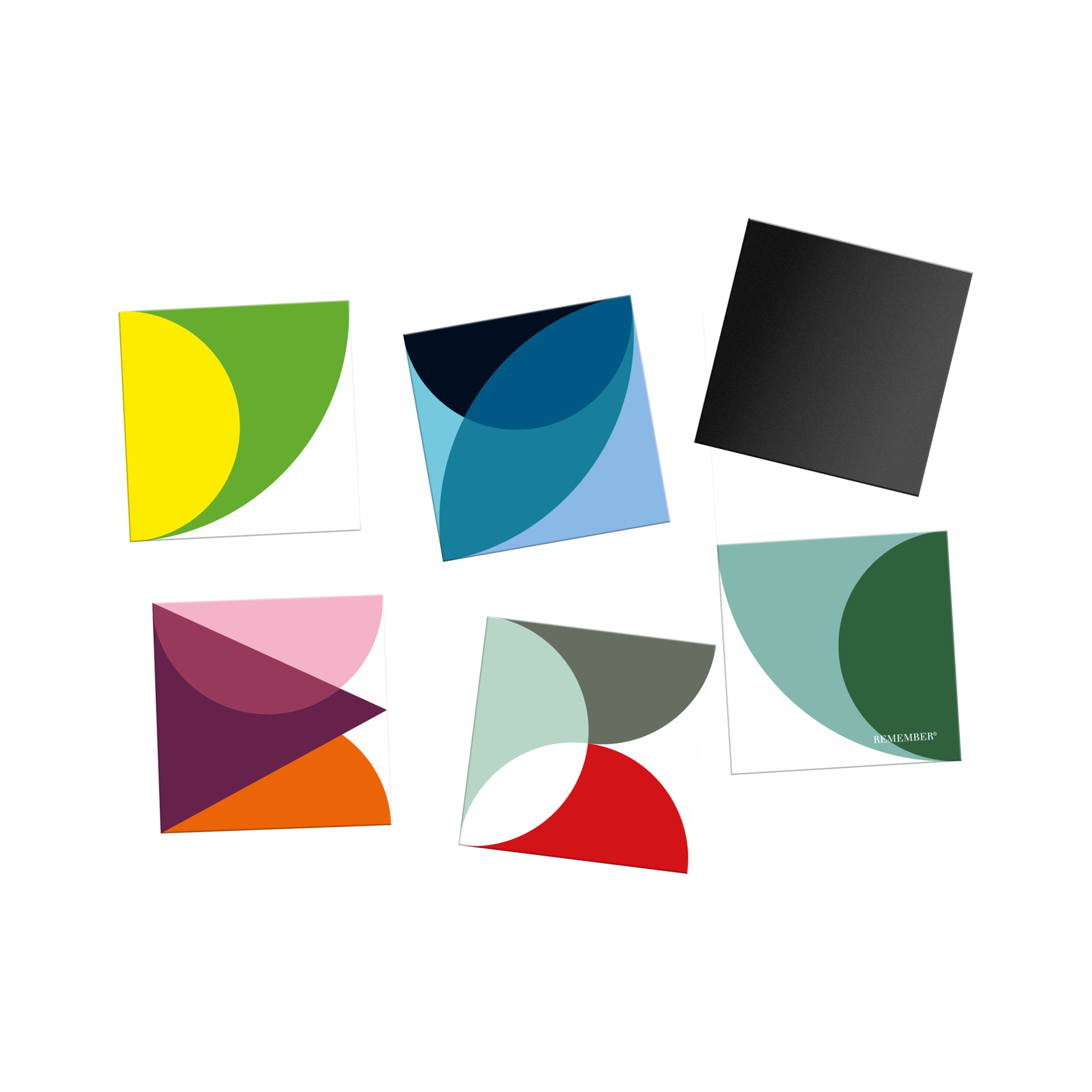 Six square Solena fridge magnets on white, staggered. Bright geometric patterns in many colours; one black; one shows “REMEMBER” logo.
