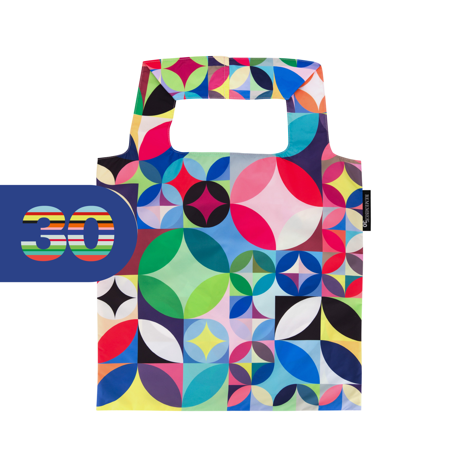 Farbenfrohe, faltbare Tragetasche mit geometrischem Rosetta-Muster aus Kreisen/Viertelkreisen in Rot, Blau, Grün, Gelb, Pink, Schwarz und Weiß. Mit zwei integrierten Griffen, auf weißem Hintergrund, plus blaues Banner „30“.