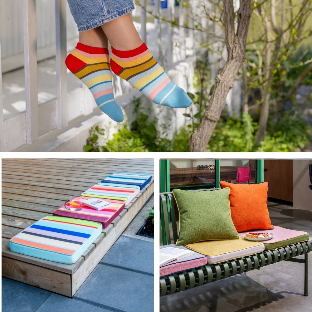 Beine in bunten Socken baumeln. Zwei Bänke mit farbigen Kissen: Holzbank mit gestreiften Auflagen, dazu Buch und Glas. Grüne Metallbank mit grünen, orangenen und gelben Kissen, ergänzt durch kleinen Kuchen.