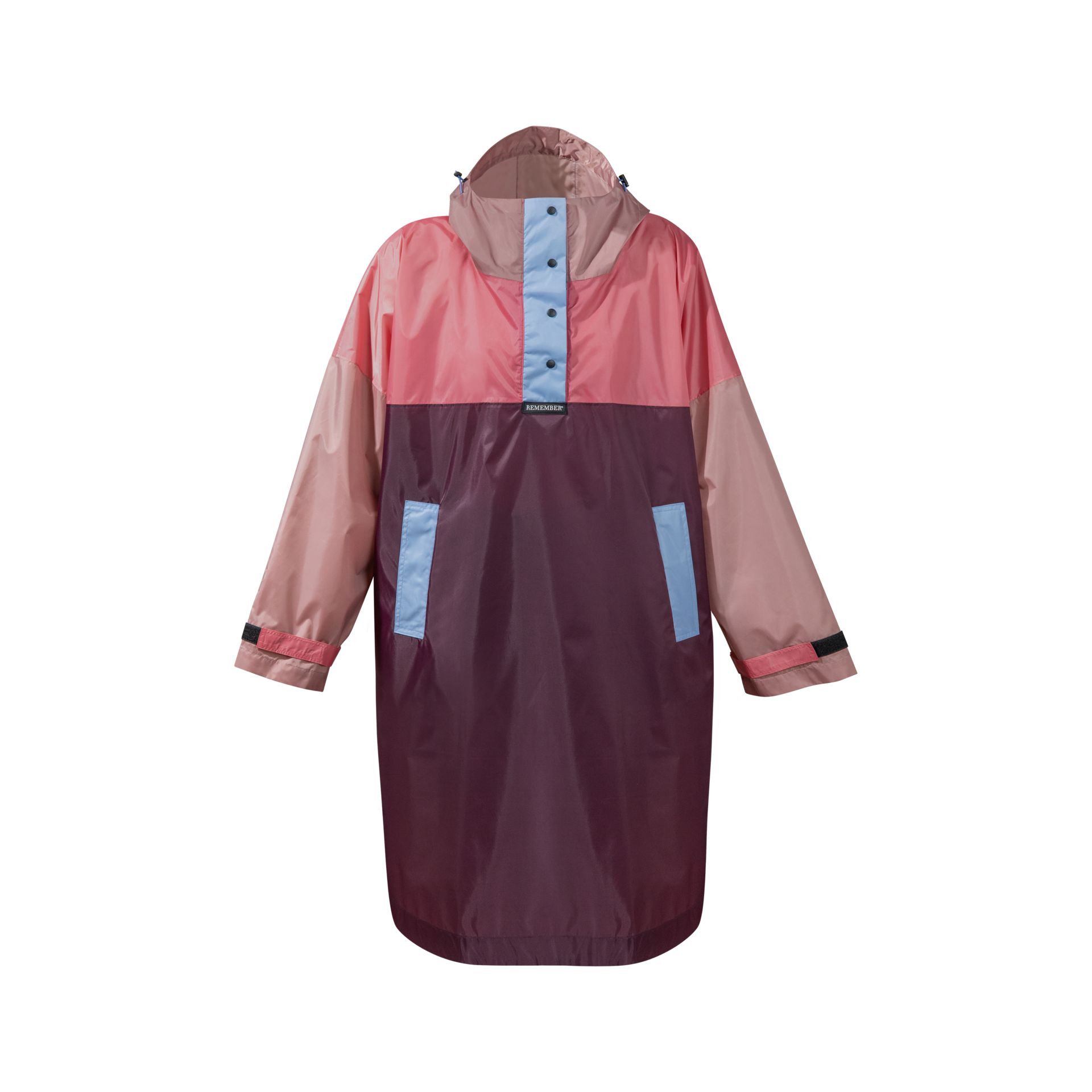 Capa para la lluvia Ida, con capucha y botones a presión, en tonos rosa, marrón y azul. Se aprecian bolsillos laterales.