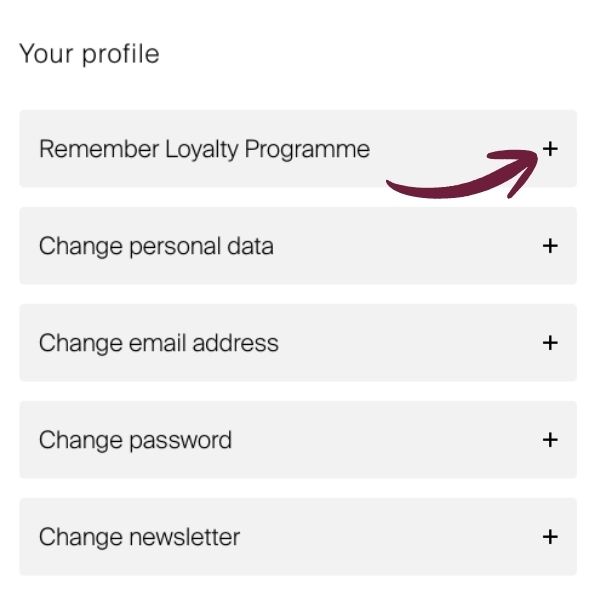 ‘Your profile’ page with 5 menu items (including Loyalty Programme, Details, Email, Password, Newsletter), each marked with a plus sign. A red, curved arrow points to the plus sign next to the first item.