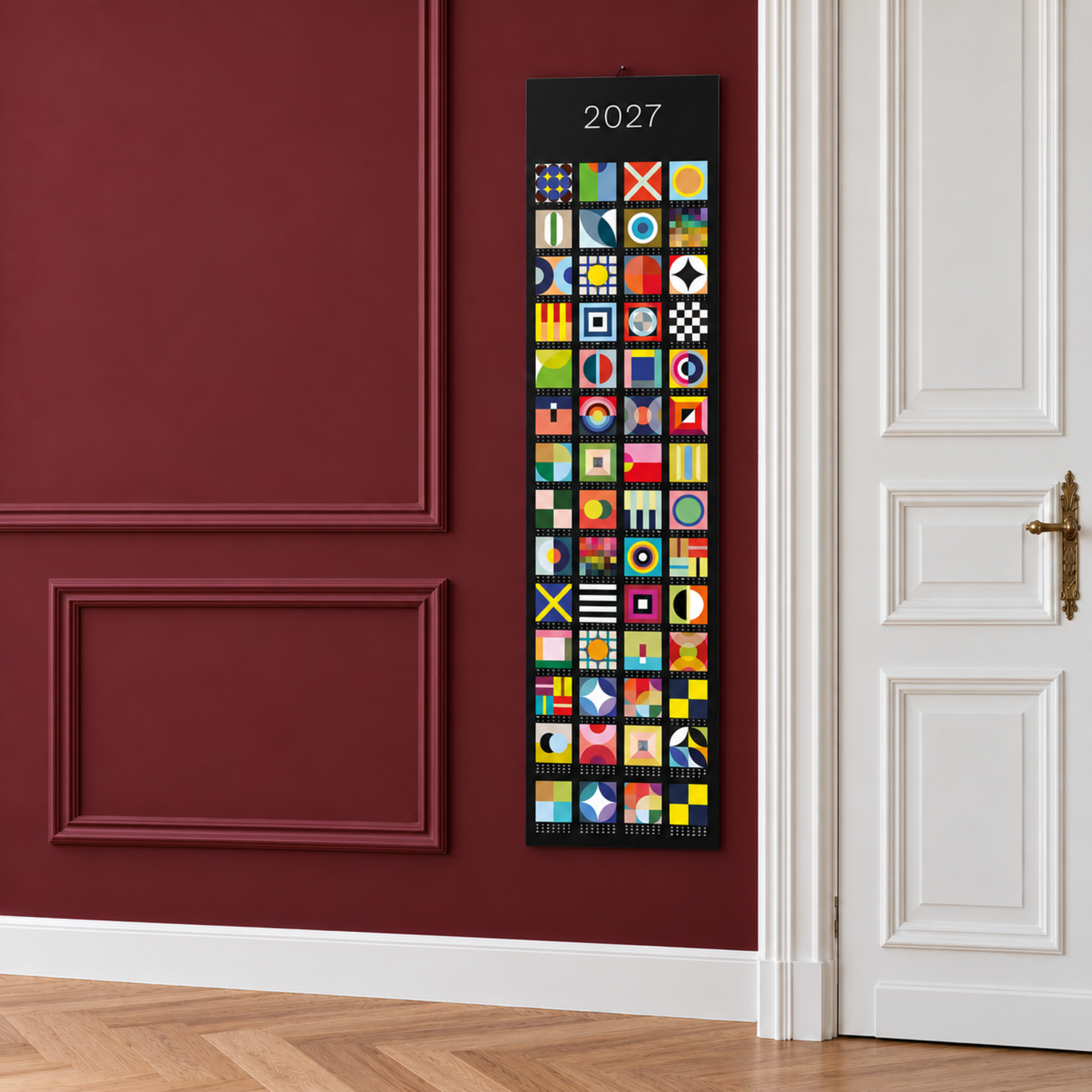 Calendrier vertical en bannière 2027 avec 52 carrés colorés et abstraits sur fond sombre. Chaque case représente une semaine et affiche des formes géométriques et motifs vivants uniques. L'année 2027 est en haut.