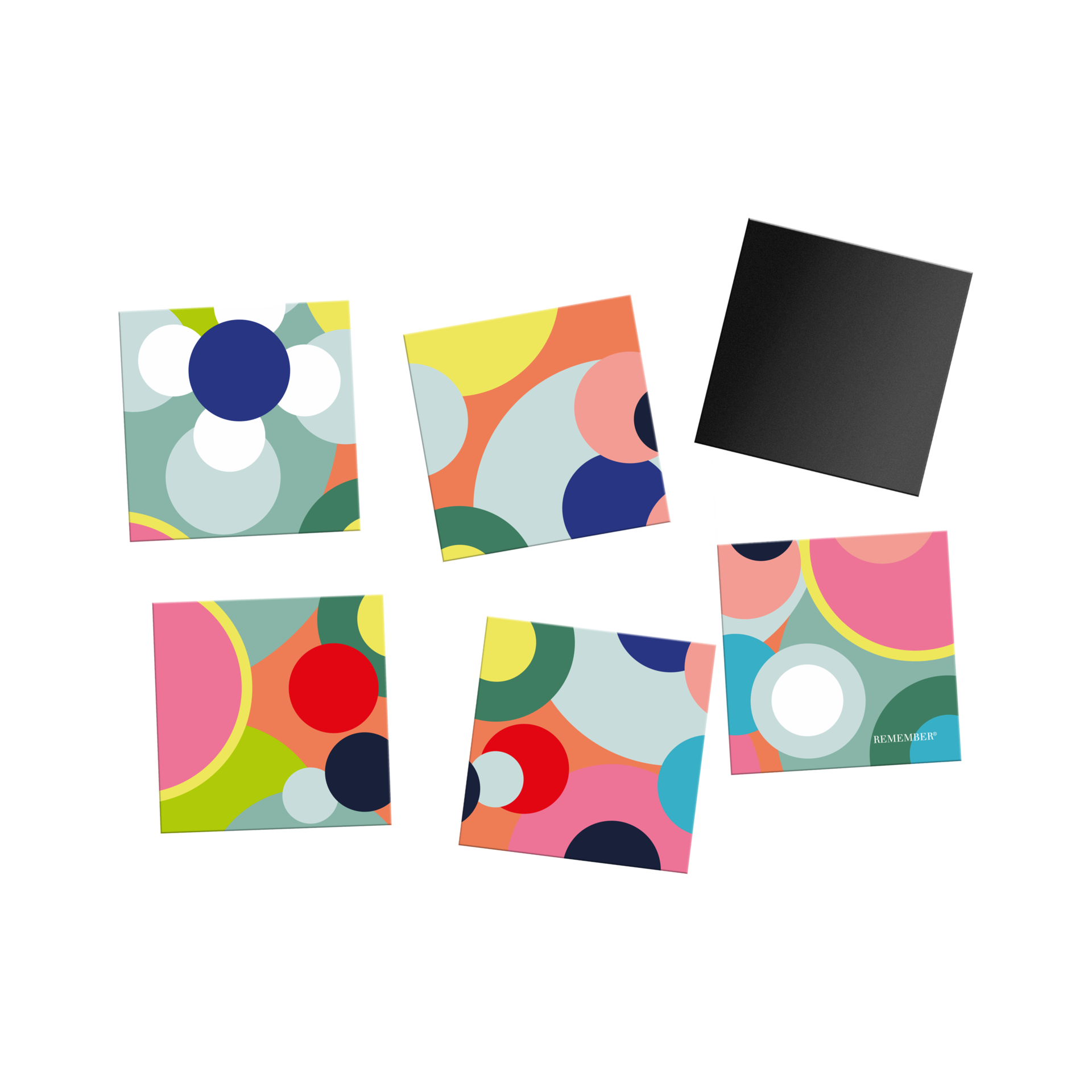 Six flexible magnetic tiles for the fridge, arranged to form a colourful abstract pattern of circles and crescent-shaped segments. Colours: blue, pink, orange, yellow, green, light blue. One tile is turned over; the reverse side is matt black.