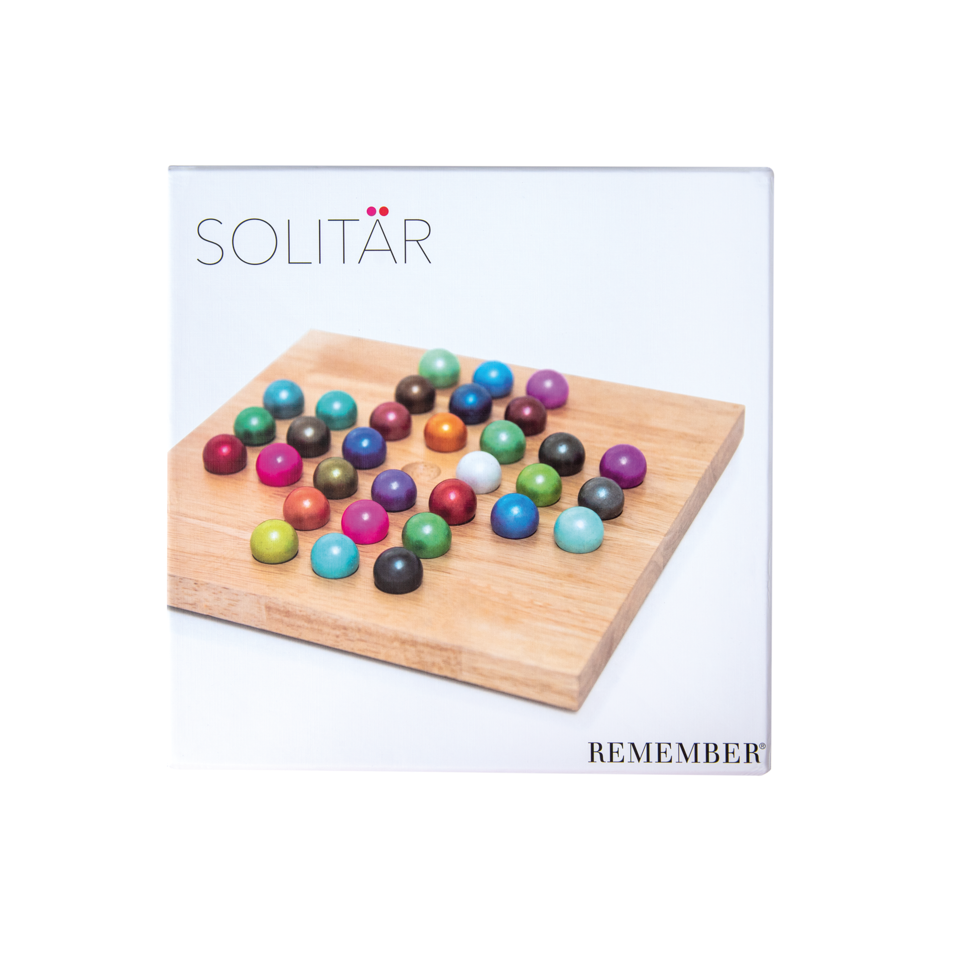 A solitaire game with coloured glass balls on a wooden board. The balls are arranged in different colours.
